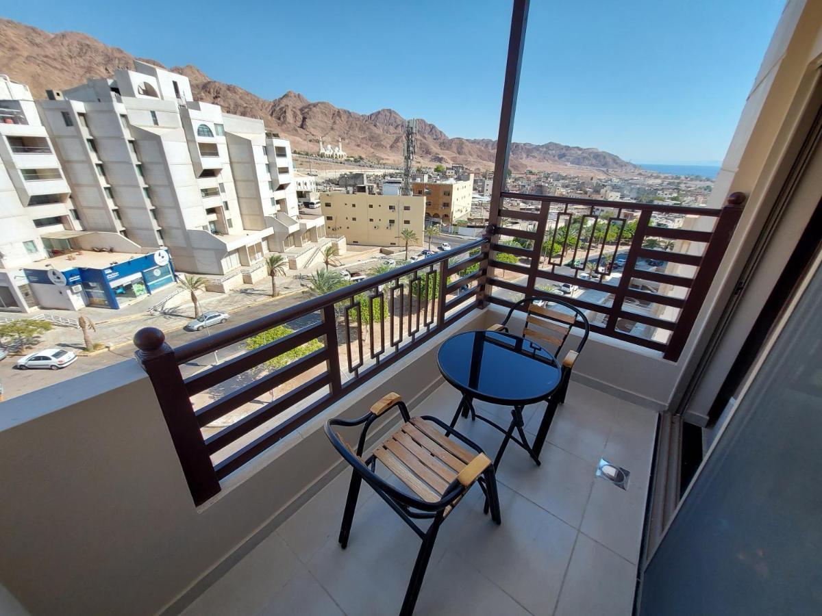 Balcony with chairs overlooking Aqaba, the mountains and the sea